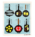 A cheerful Finnish dishcloth featuring playful frying pans on a bright blue background. The pans are filled with colorful vegetables, hash, and toast, creating a fun and cozy kitchen motif perfect for everyday use. disktrasa med stekpannor med blå bakgrund.Suomalainen tiskiliina paistinpannuilla kirkkaalla sinisellä taustalla